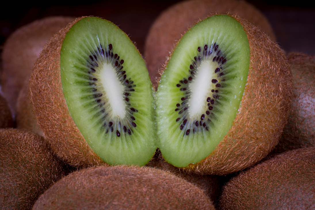 Green and Brown Sliced Kiwi Fruit in Close Up Photography